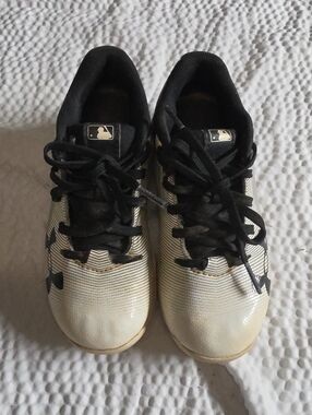Under Armour Kids White and Black Athletic Cleats